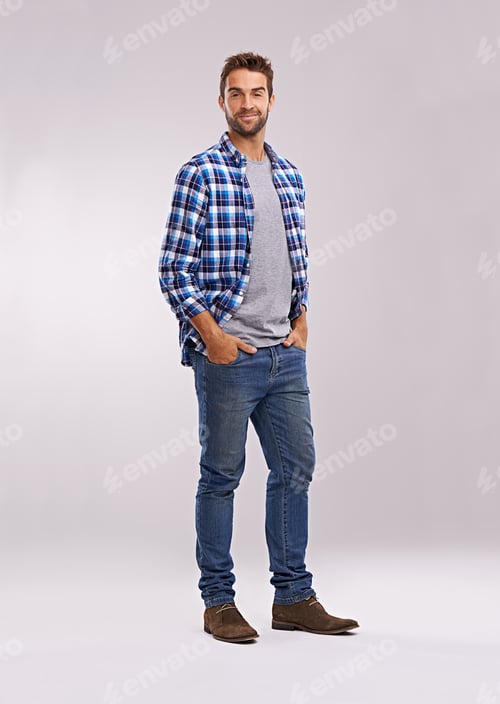 Preview: Rugged and manly. Studio shot of a handsome man against a gray background.