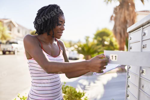 Preview: african american woman checking mail in las vegas