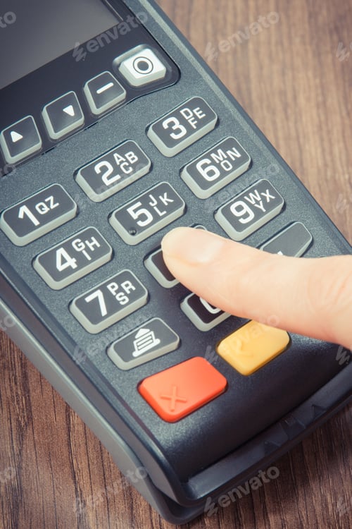 Preview: Hand of woman using credit card reader to enter PIN code. Cashless paying. Finance and banking