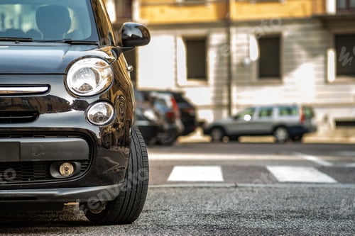 Preview: Modern cars parked on city street side in residential discrict. Shiny vehicles parked by the curb