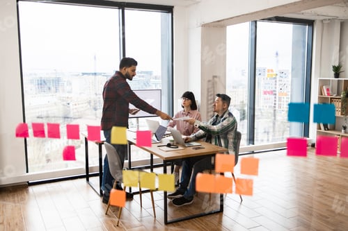 Preview: Team brainstorming session with sticky notes in modern office