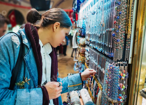 Preview: Young girl tourist walking in the souvenir market