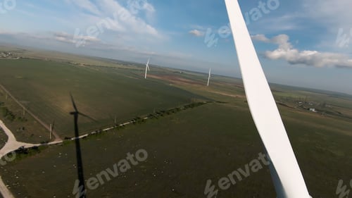 Preview: Beautiful green fields, drone view. Shot . A bright view of the helicopter wings and below you can
