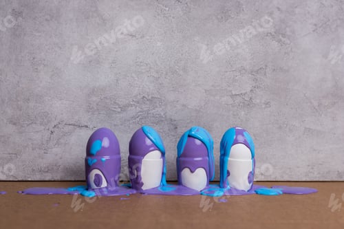 Preview: Coloring eggs in cups on grey background