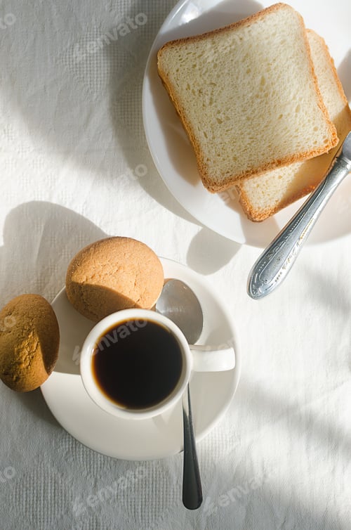 Preview: Breakfast with coffee, sweets and toast.