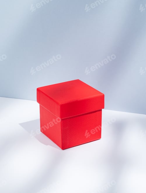 Preview: Red box on a white and blue background with soft shadows. Concept of a gift for a holiday