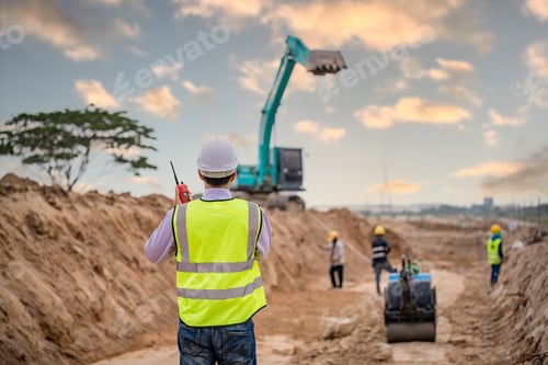 Preview: Construction engineer wear safety uniform under inspection and survey workplace by radio communicati