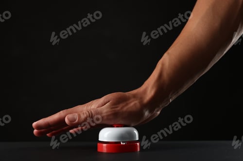 Preview: Man pressing button on black background, closeup. Space for text