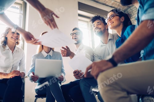 Preview: Creative business people working on business project in office