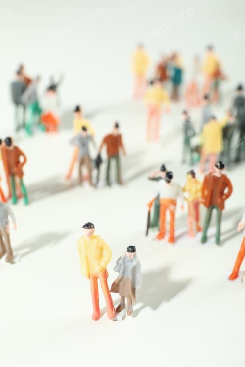 Preview: Toy people on white background, selective focus