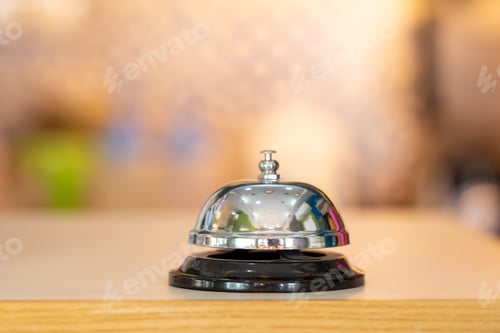 Preview: Restaurant or hotel bell of services calling on wooden counter