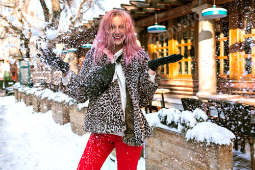 Preview: Winter outdoor fashion portrait of stylish young woman posing at snowy European city,