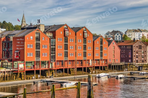 Preview: Beautiful shot of red houses near the water in Trondheim, Norway