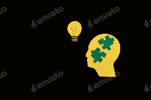 Preview: yellow Silhouette of a head with puzzle pieces and a lightbulb on Black Background,