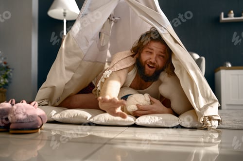Preview: Funny freelance businessman awake in teepee tent