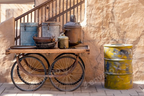Preview: Rusty vintage kitchenware on a wheeled wagon, UAE heritage
