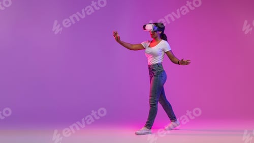 Preview: Virtual Reality Experience. Amazed Black Woman Playing Video Game In VR Glasses