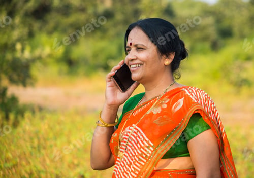 Preview: Indian woman talking on smartphone.