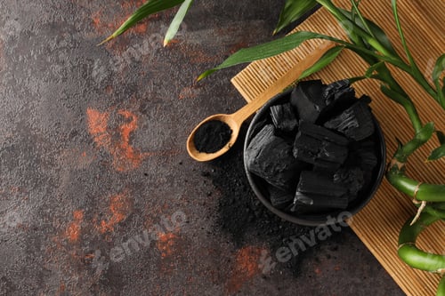 Preview: Bowl with charcoal and spoon with powdered charcoal, space for text