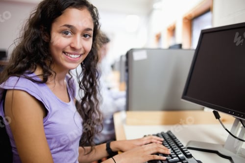 Preview: Cute Smiling Student With A Computer In An It Room