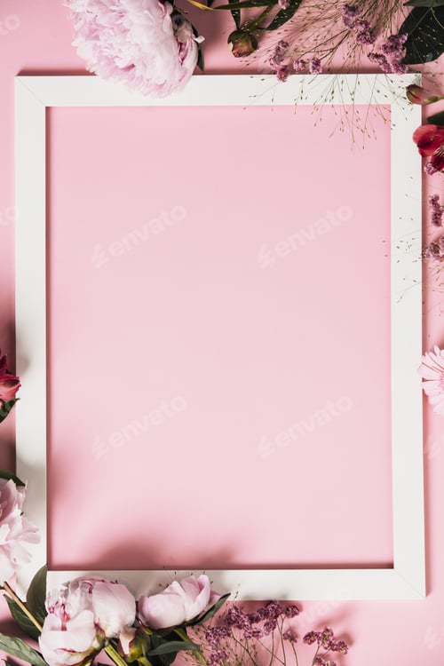 Preview: Assorted pink flower and white frame border on pink background, flat lay