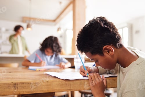 Preview: Two brothers drawing at kitchen table