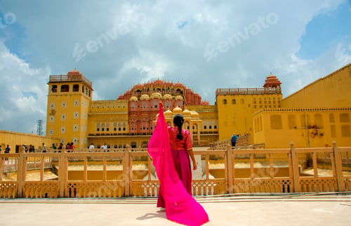 Preview: Woman in Hawa Mahal and enjoying holiday at Jaipur, Rajasthan, India.