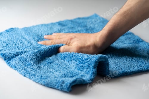 Preview: a hand holding microfiber rag and wipe surface, home cleaning