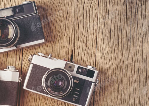 Preview: vintage old film camera on wood board