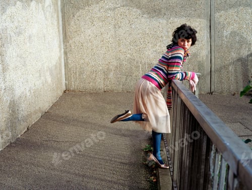 Preview: Woman leaning on a railing