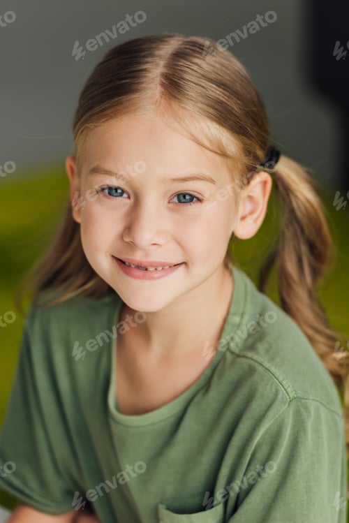 Preview: portrait of adorable little child smiling at camera