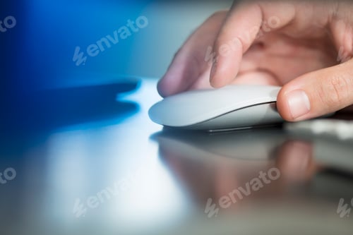 Preview: Man's hand using computer mouse