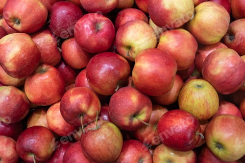 Preview: A box full of red ripe apples, close-up, top view. Pattern of juicy delicious apples