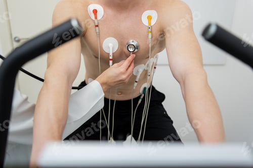 Preview: Determined athlete undergoing rigorous cardiac stress test in clinical setting