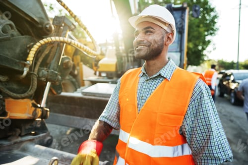 Preview: Portrait of young construction engineer wearing hardhat