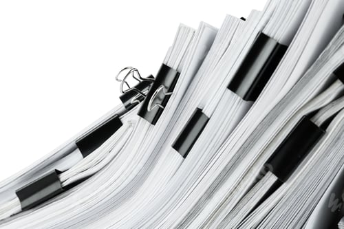 Preview: Pile of documents with binder clips, closeup