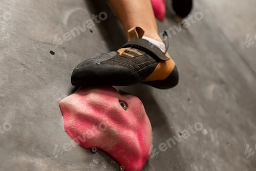 Preview: foot of woman exercising at indoor climbing gym