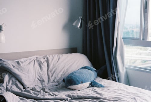 Preview: Shot of small shark pillow on bed