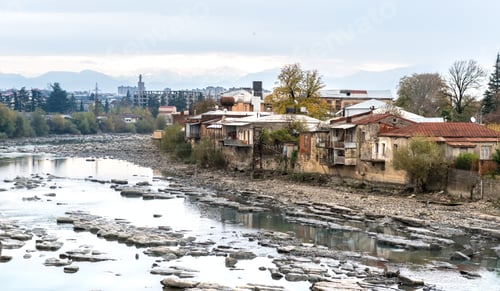 Preview: Wrecked buildings of Kutaisi, mountain river in centre, Georgia