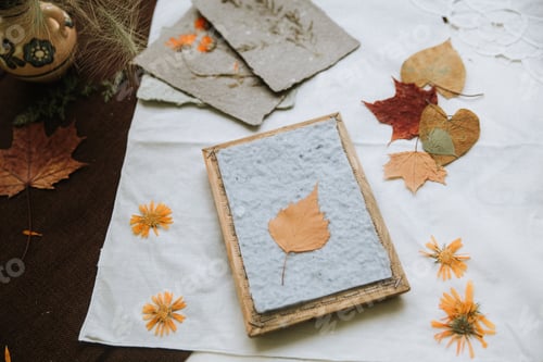 Preview: flatlay handmade paper with autumn leaves and dried flowers