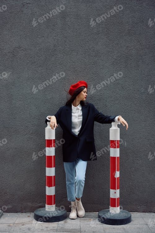 Preview: Fashion woman standing on the street in front of the city and road works tourist in stylish clothes