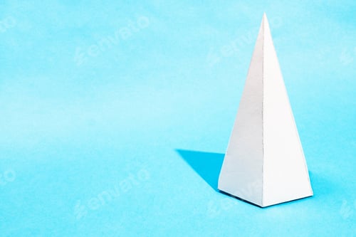 Preview: tall hand-crafted paper pyramid on turquoise blue