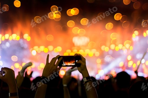 Preview: Crowd of concert stage lights and people fan audience silhouette raising hands or glow stick holding