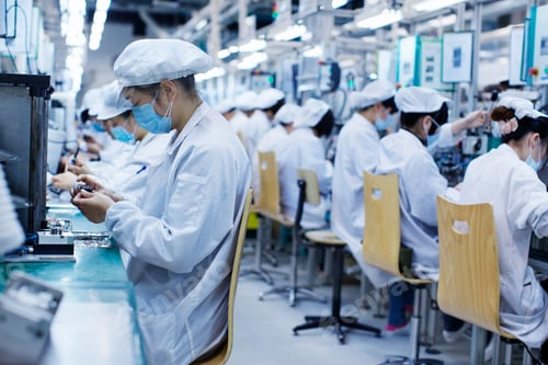 Preview: Group of workers at small parts manufacturing factory in China, wearing protective clothing, hats