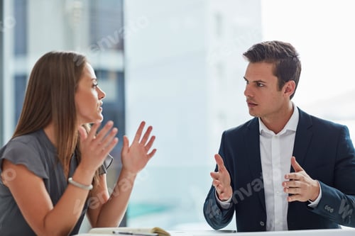 Preview: Cropped shot of two businesspeople having a discussion in the office