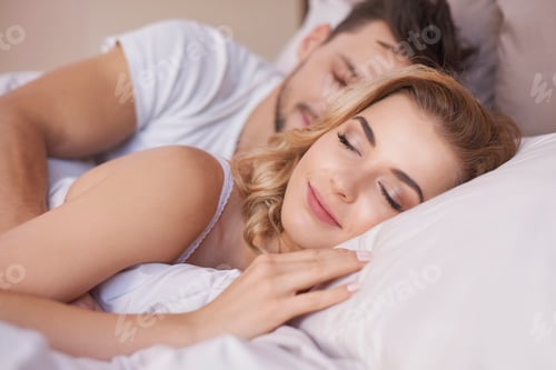 Preview: Sleeping couple in comfortable bed