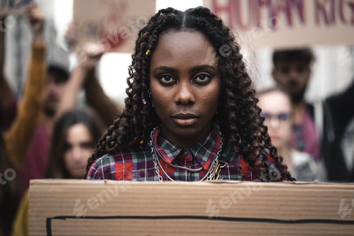 Preview: Portrait of African protest marcher with placard