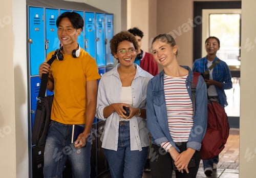 Preview: Walking in high school hallway, teenagers smiling and carrying backpacks