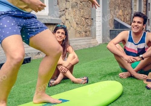 Preview: Young couple having fun in a surf class