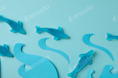 Preview: Gummy candies in the form of whale and decorative waves on blue background